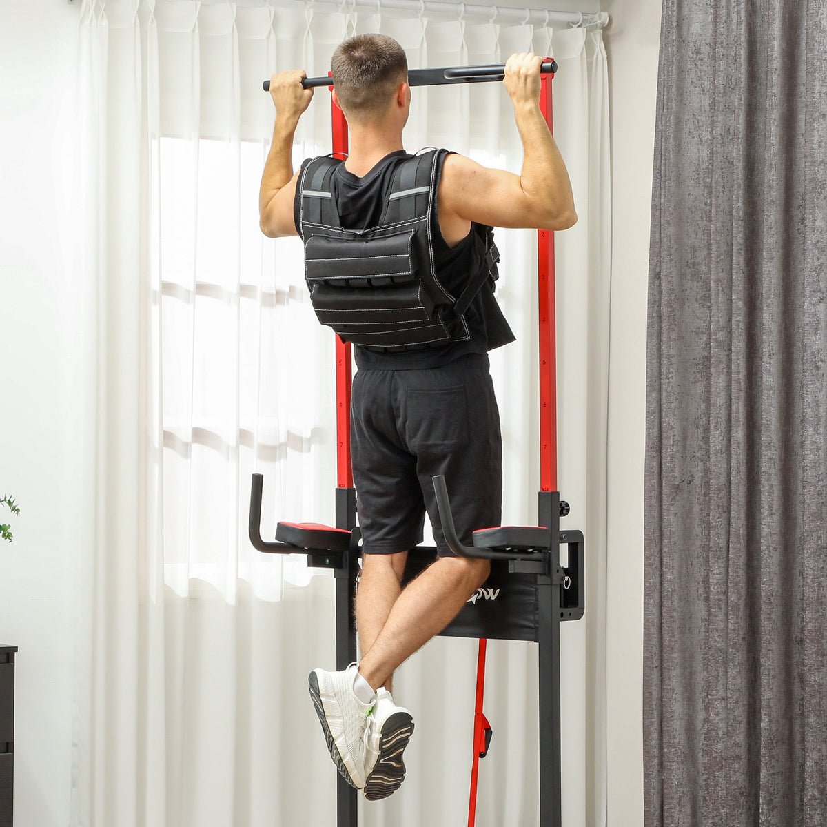 Man doing pull-ups wearing the running weight vest for exercise