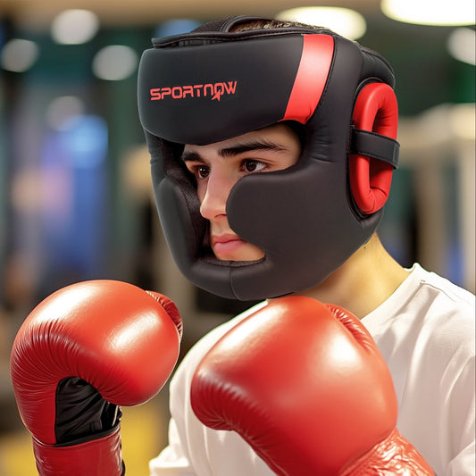the boxing headguard worn by a person wearing red boxing gloves in a gym setting