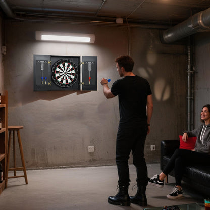 A bristle dartboard with cabinet in a modern games room with two people playing darts