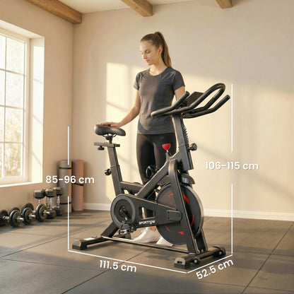 The indoor bike showing height and length dimensions in a home gym setting