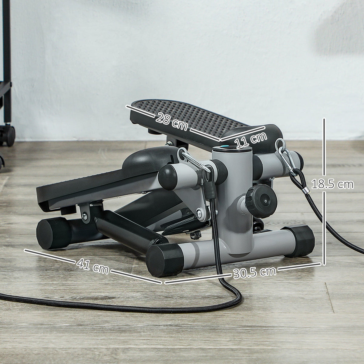 The compact exerciser showing the product dimensions with white measurement lines