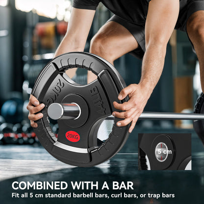The black weight disc being placed onto a barbell