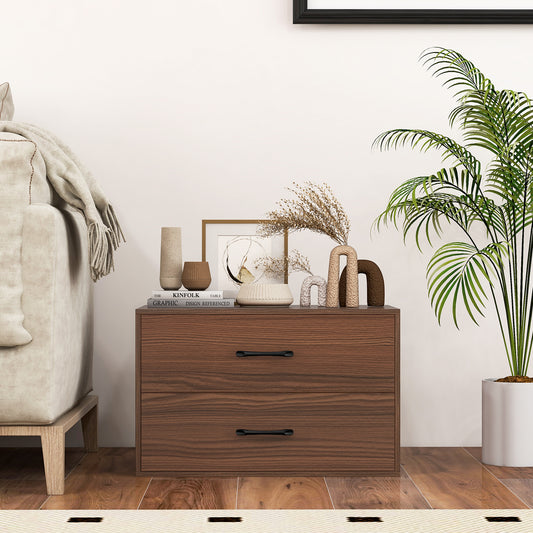 Walnut finish two drawer dresser next to a sofa and plant