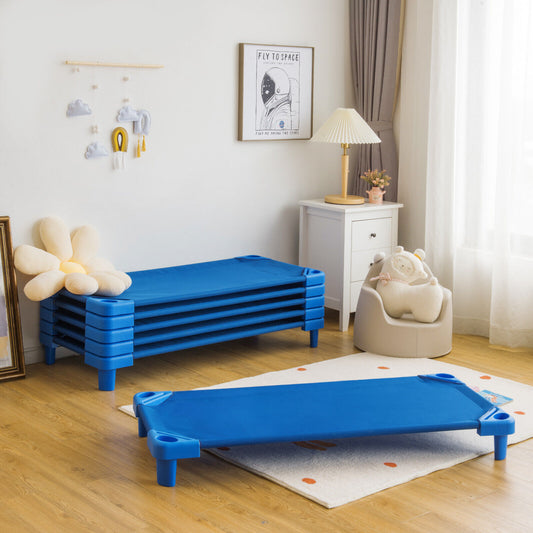Stackable kids nap cot bed in a room with other stacked beds and a child's chair