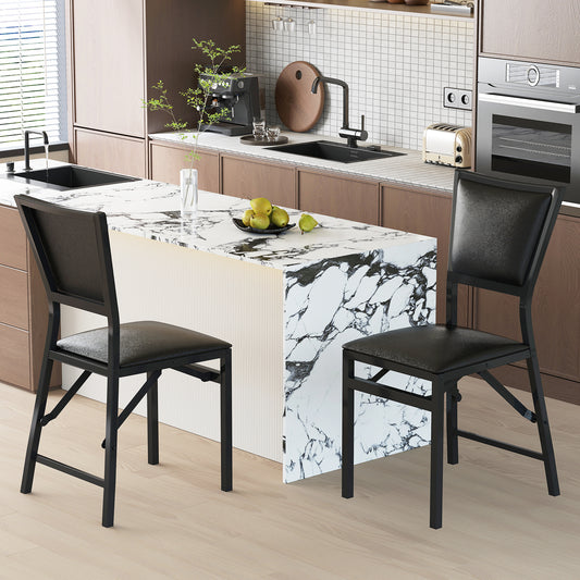 The dining chairs placed in a modern kitchen setting with a marble island