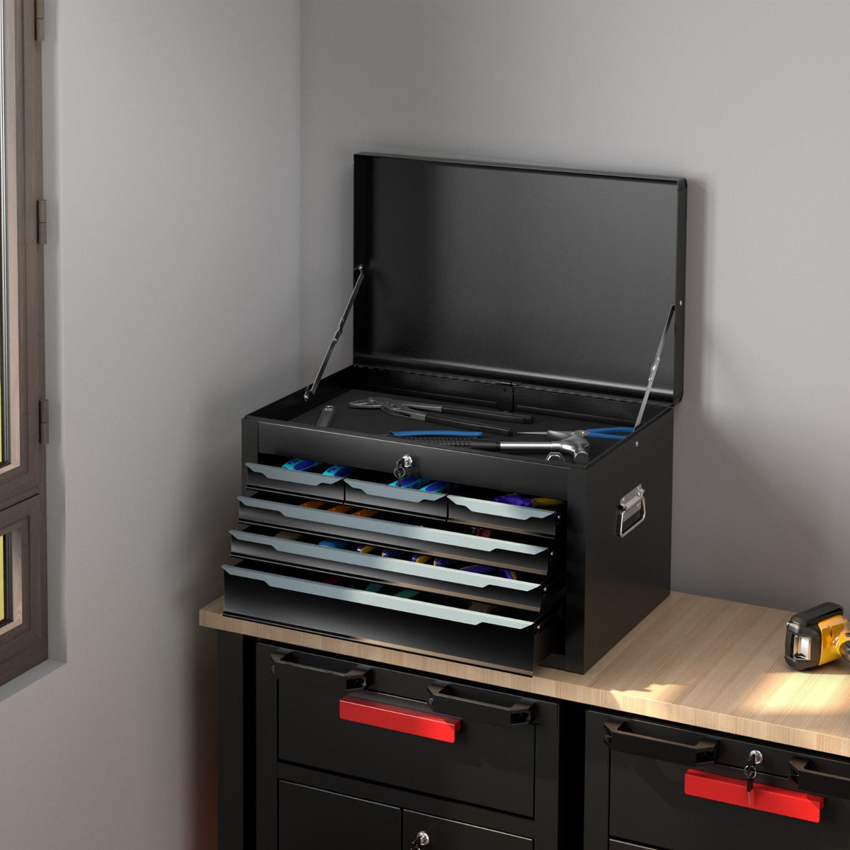 The garage storage chest placed on a workbench with tools inside the open drawers