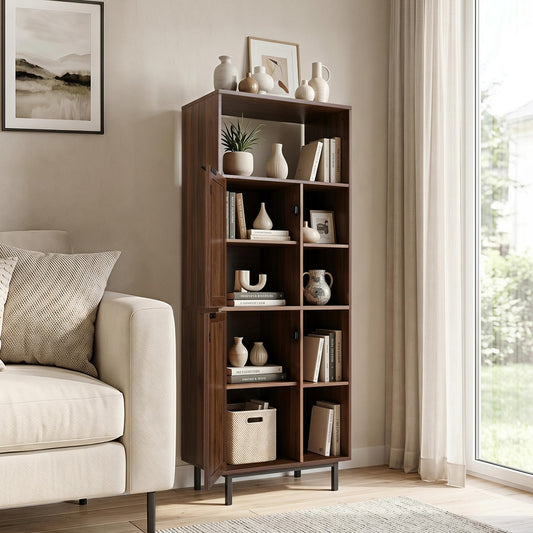 The cabinet styled with books and decorative items in a bright living room next to a sofa