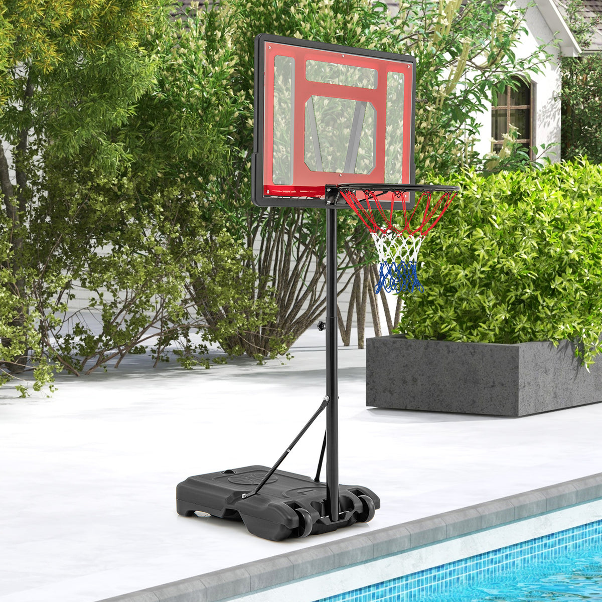 The sport equipment placed on a patio next to a swimming pool in a garden setting