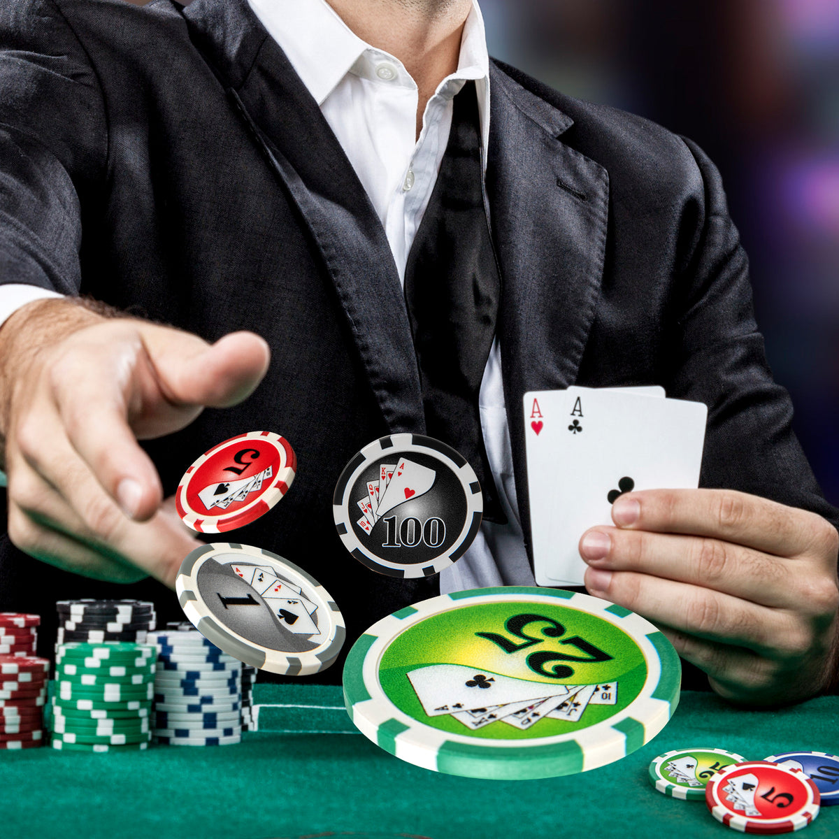 A man in a suit throwing poker chips and cards in the air during a game