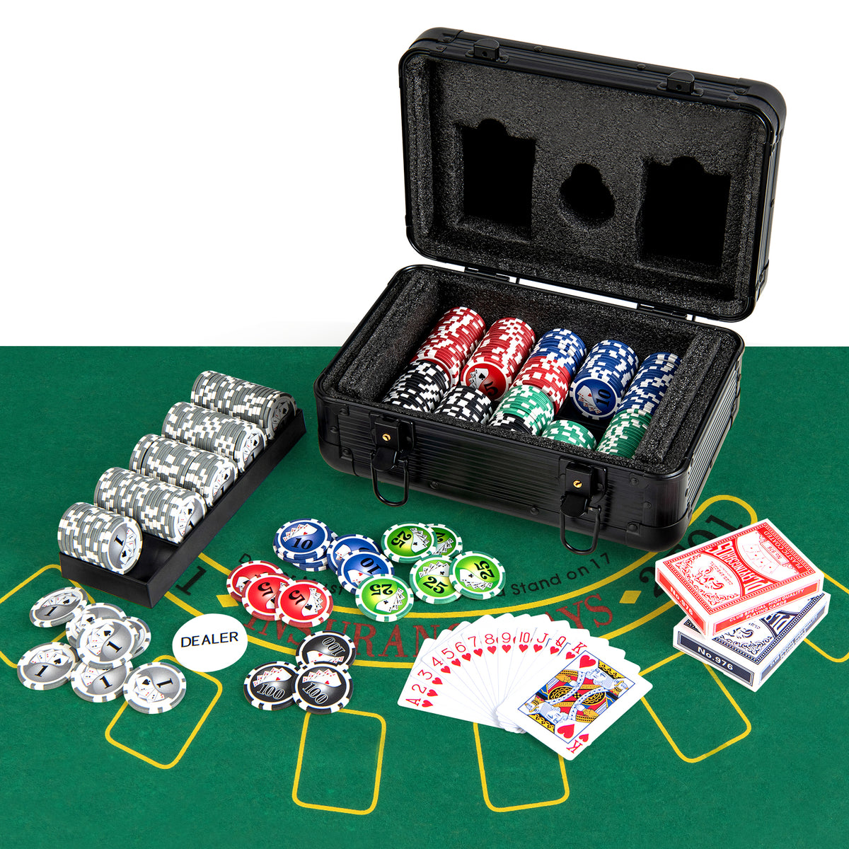 Poker chip set laid out on a green felt mat with an open case, decks of cards, and chips