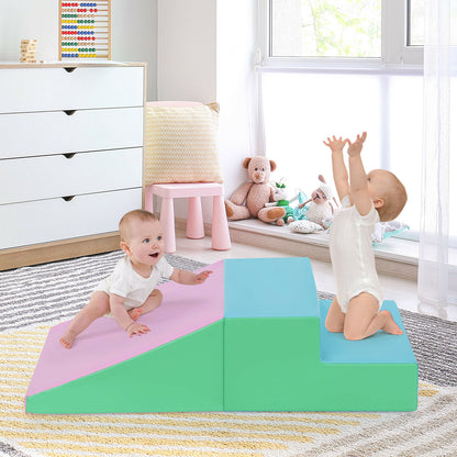 Pink and green soft play set with two babies interacting in a nursery room