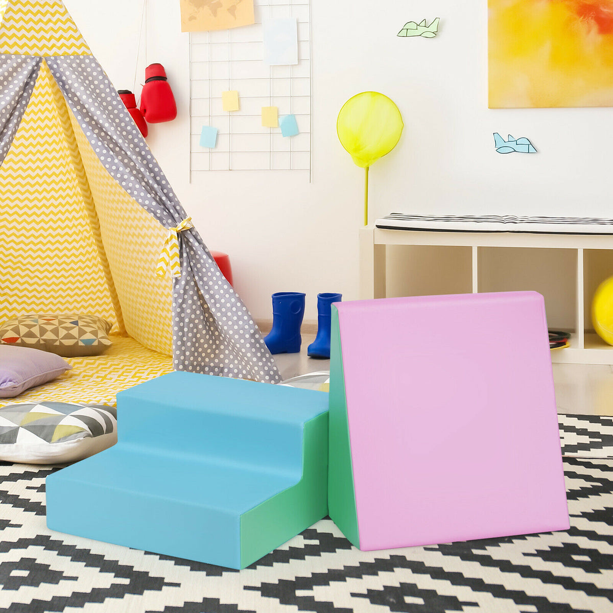 Blue and pink soft play set in a child's playroom with a teepee