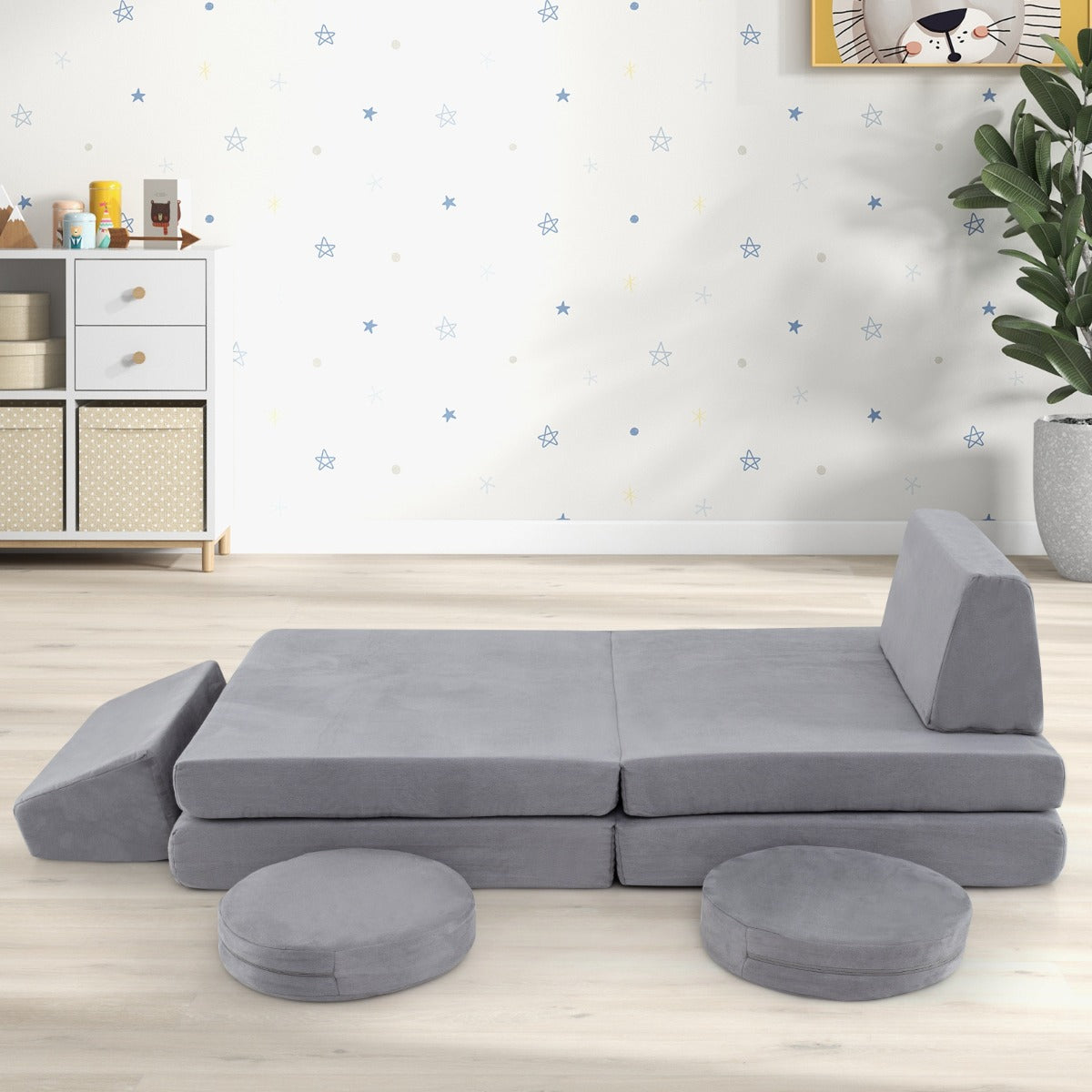 The kids seating set arranged as a flat play surface with a single backrest cushion