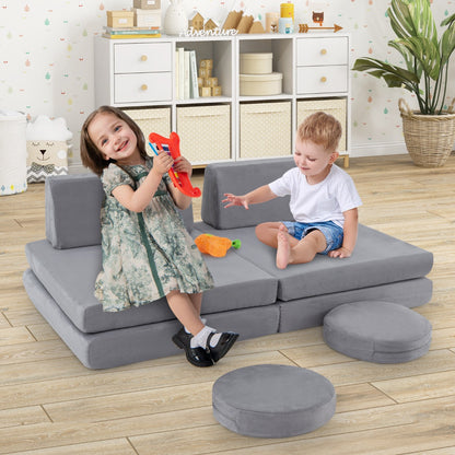 The kids seating set in a playroom with two children playing on the grey foam cushions