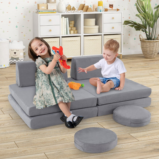 The kids seating set in a playroom with two children playing on the grey foam cushions
