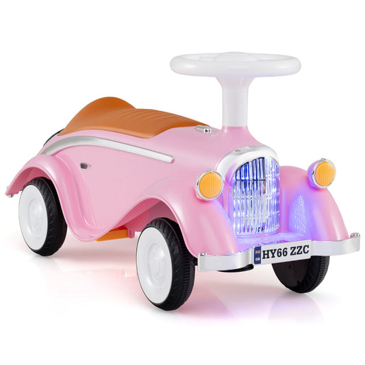 Toddler Ride on Toy in pink with a steering wheel and lights on the front grill