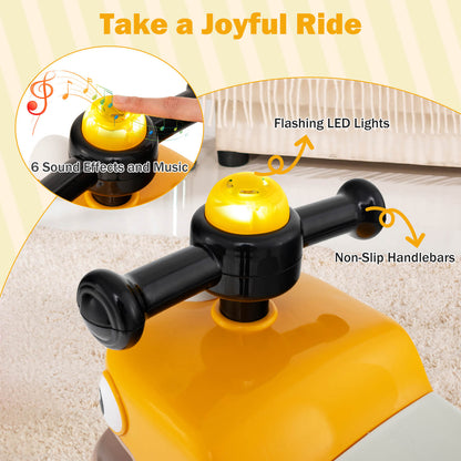 Close up of the yellow ride on toy's handlebars with flashing lights