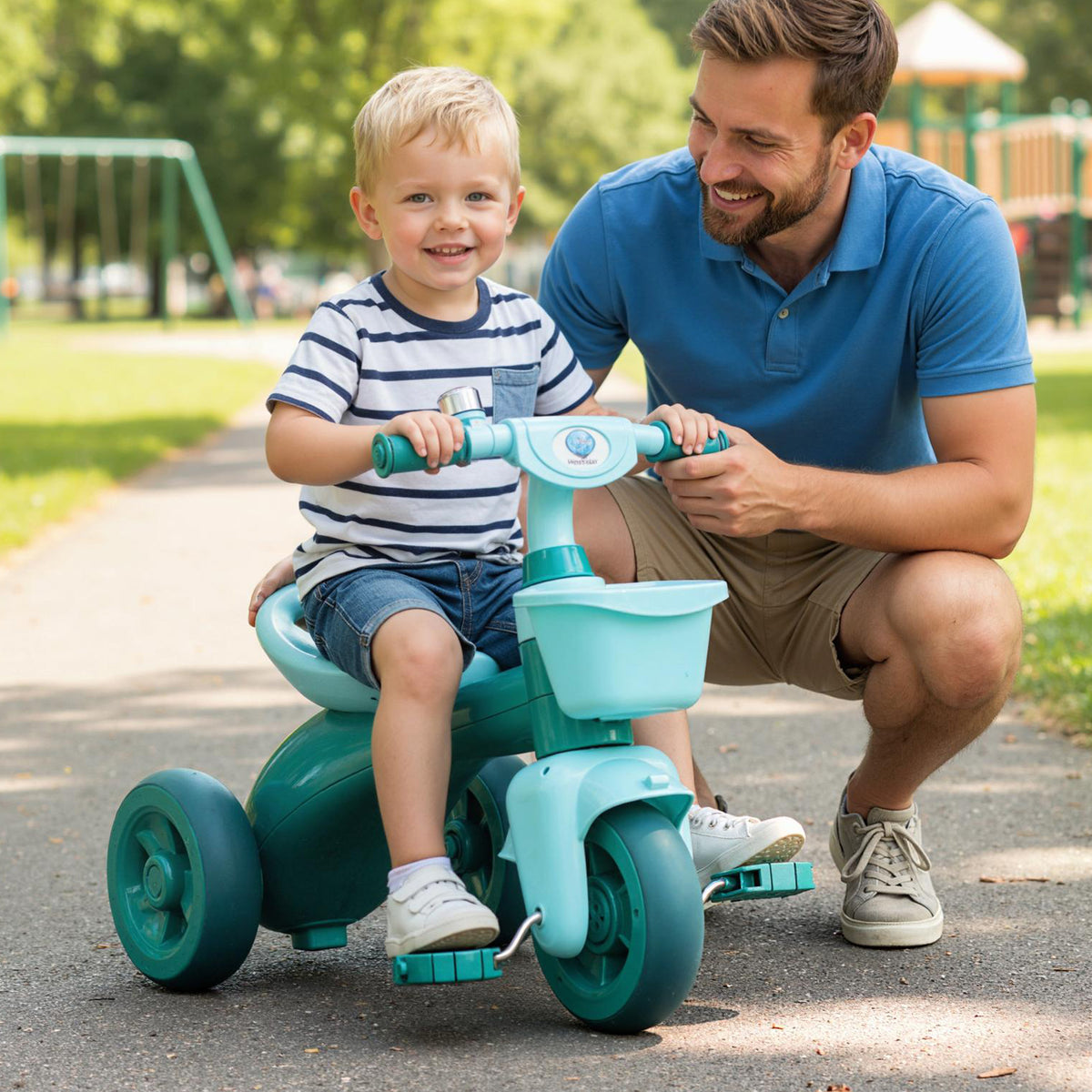 Toddler Tricycle, the ride on toy with a young boy sitting on it while his father holds the handlebars for support