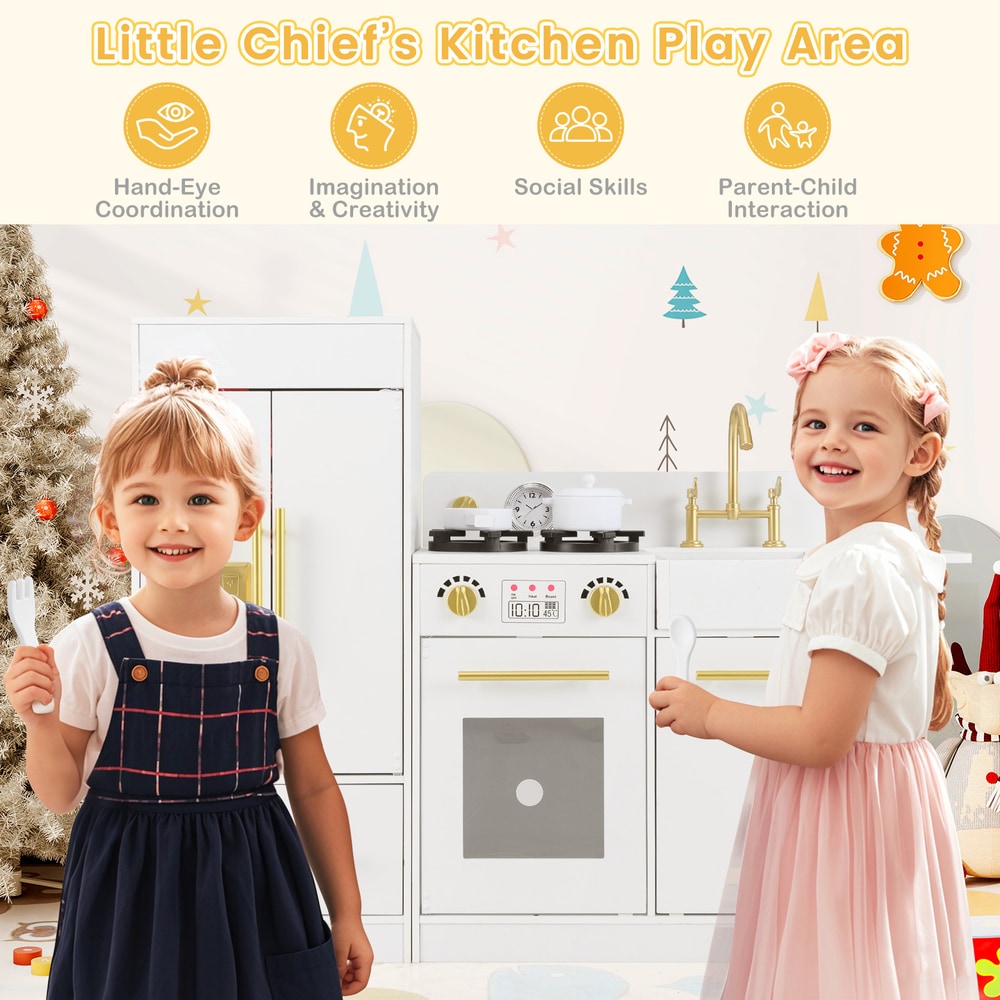 Two happy toddlers in front of the toy kitchen playset, one holding a spoon and the other a fork