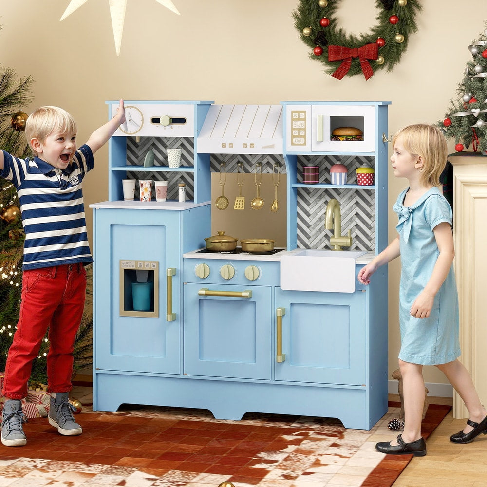 Children playing with the blue toy kitchen playset in a decorated room