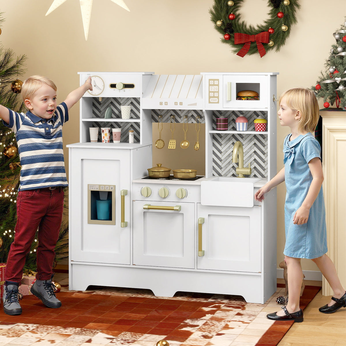 Children playing with the white toy kitchen playset in a festive room