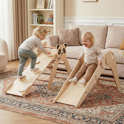 The climbing frame with two children playing on the slide and climbing ramp