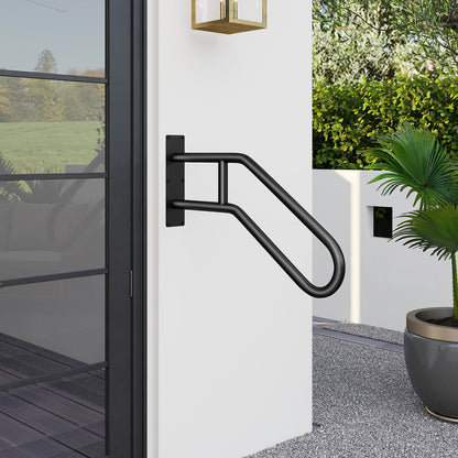 The safety handrail mounted on an exterior wall next to a glass door