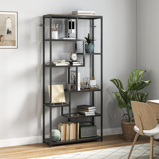 The geometric bookcase styled in a room with books and plants on the shelves