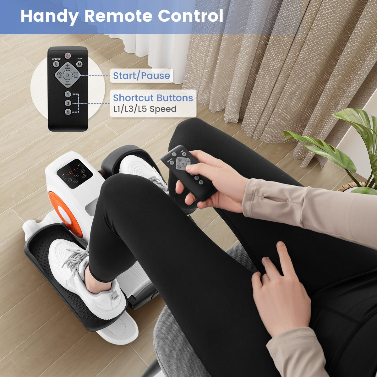 Hand holding the remote control for the exercise machine