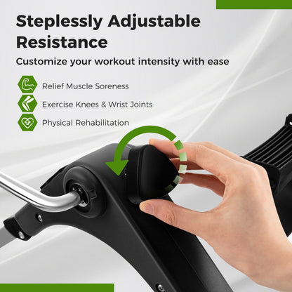 The exercise bike resistance knob being adjusted by a hand