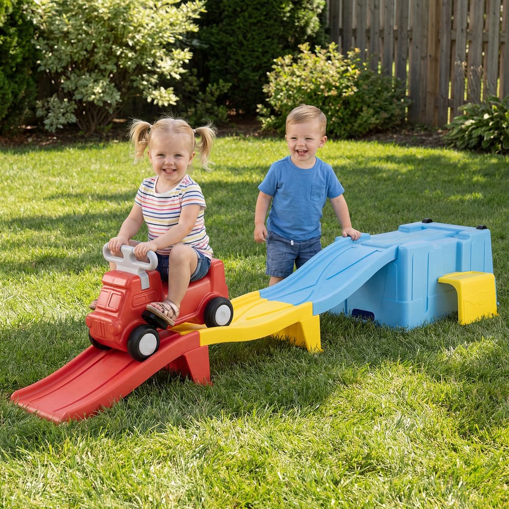 The push and pedal ride on toy with two children playing on the track in a grassy garden
