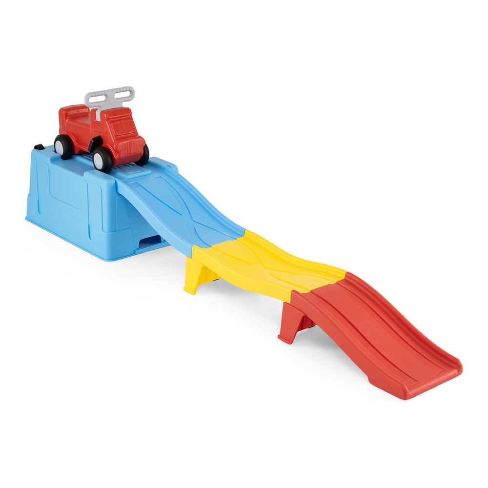 The blue, yellow and red roller coaster track with the red car on top, set up indoors