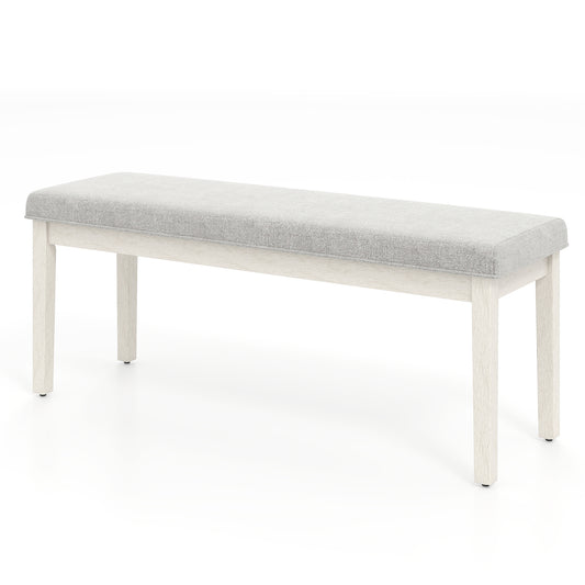 Upholstered Dining Bench with a light grey padded seat and four sturdy wooden legs