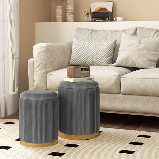 The grey ottomans placed in a living room next to a sofa with a radio on the larger seat