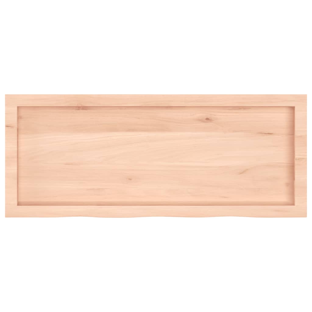 The rectangular solid wood countertop with a slightly wavy edge