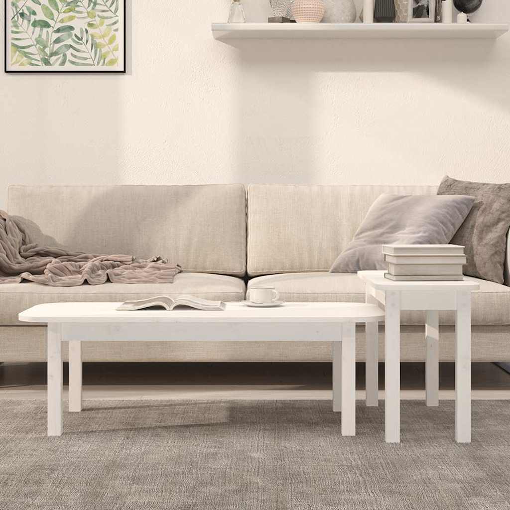 Two white pine coffee tables in a living room with a sofa and a book on the larger table