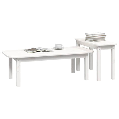 A white pine coffee table set with books on the smaller table and an open book on the larger one