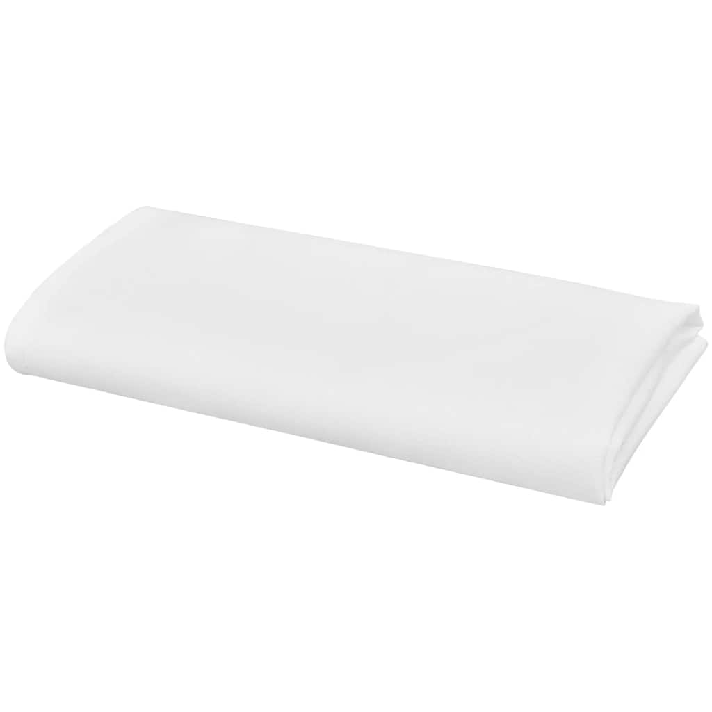 A single white cloth napkin folded in half lengthwise, showing its smooth texture