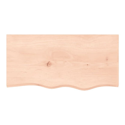 The wall shelf seen from directly above showing the wood grain and live edge detail
