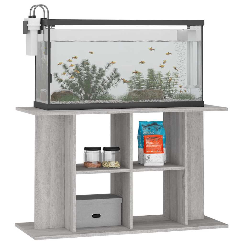 The aquarium stand holding a glass fish tank and various pet supplies on the shelves