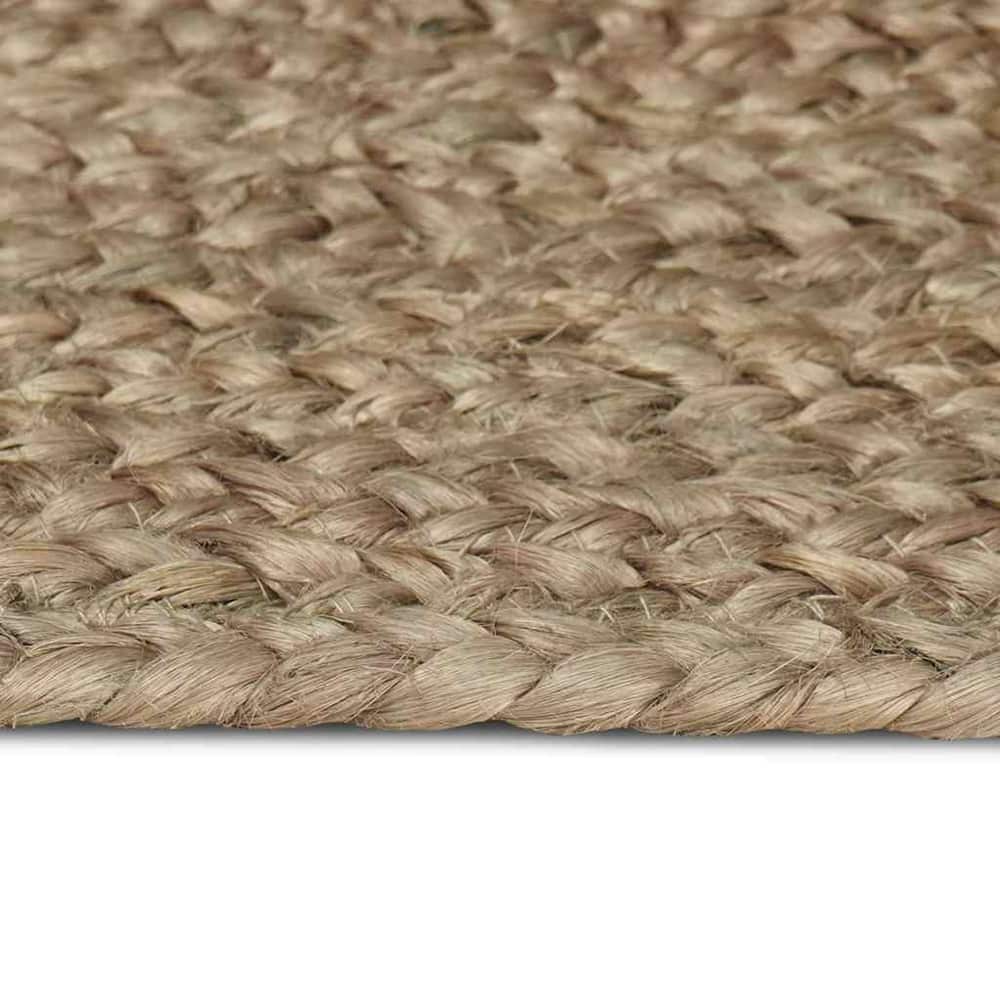 Close-up of the braided weave of the grey jute rug