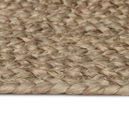 Close-up of the braided weave of the grey jute rug
