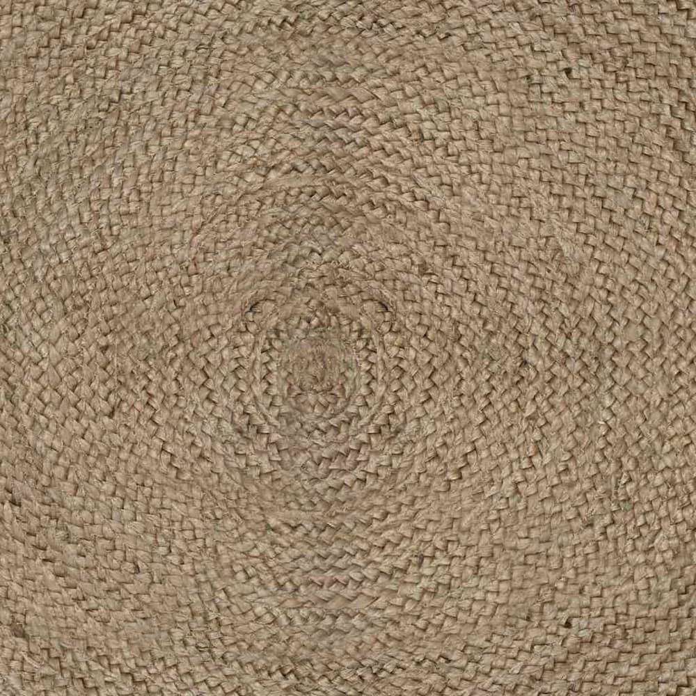 Close-up of the circular woven pattern of the grey rug