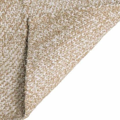 Close up of the natural and white jute rug, showing the herringbone weave pattern