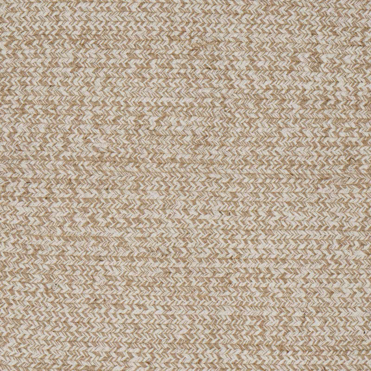 Close-up of the braided texture of the white jute rug, showing the woven pattern