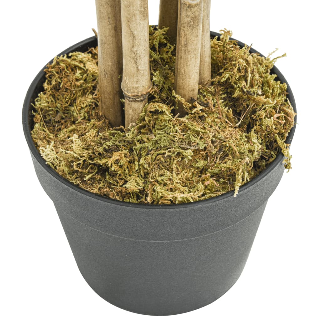 The base of the artificial bamboo tree showing the pot and mossy covering