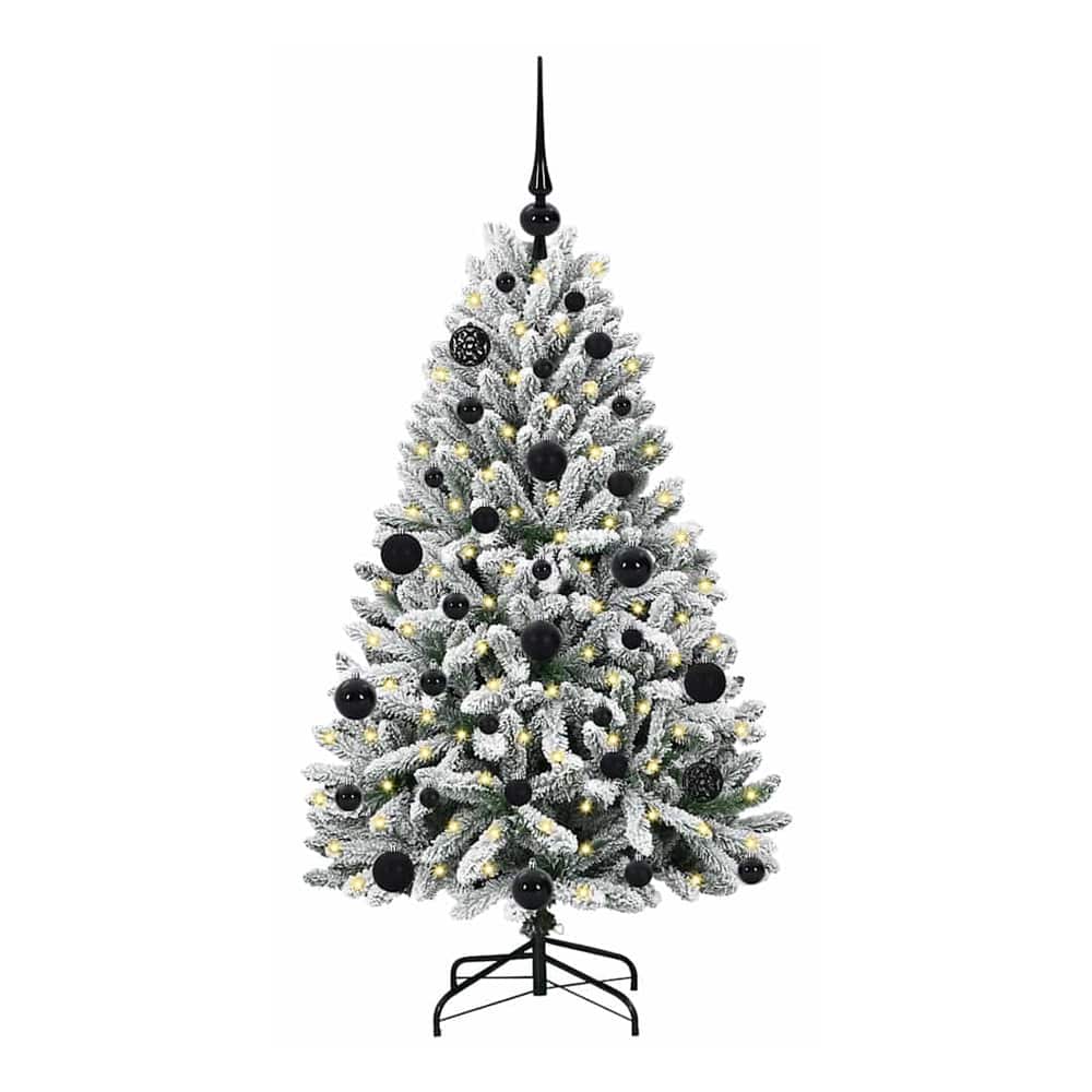 The artificial Christmas tree standing on its black metal base, decorated with baubles and lights