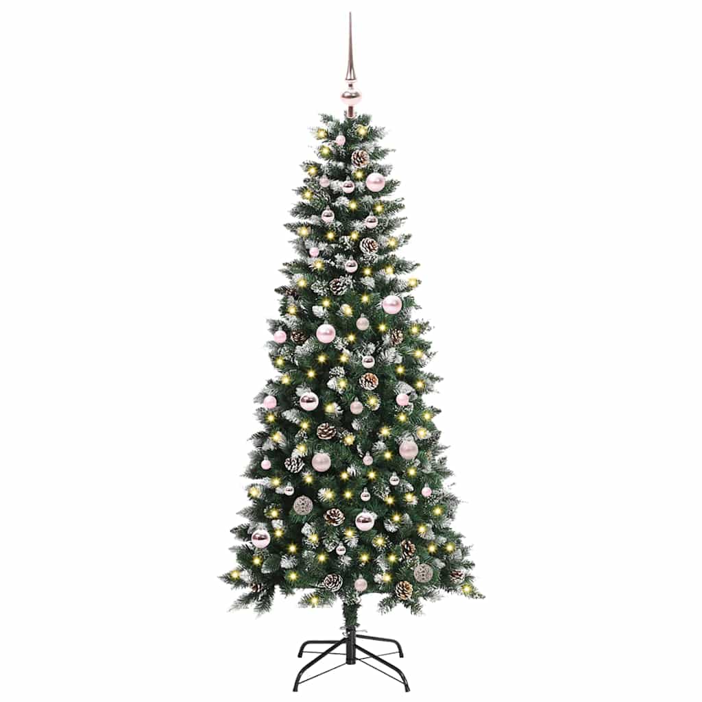 The green artificial Christmas tree is fully decorated with baubles and lights