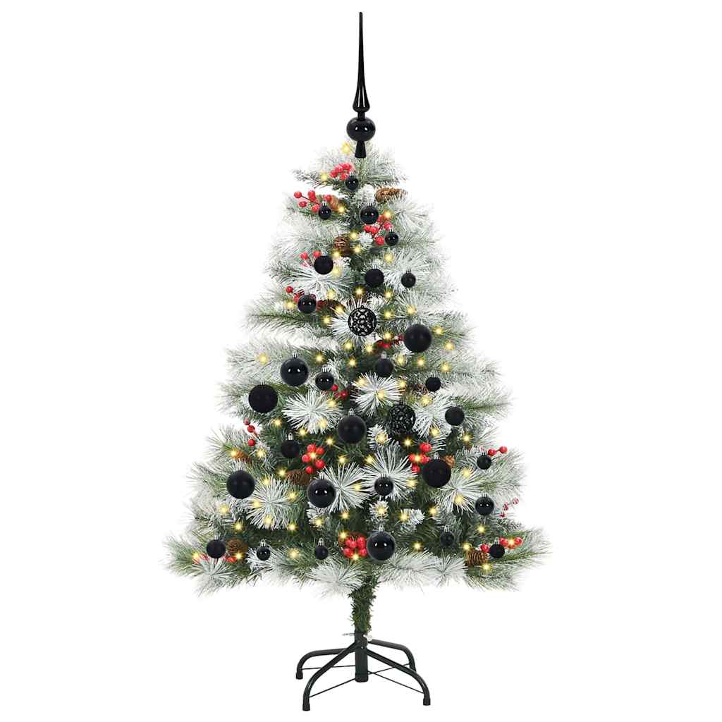 The artificial Christmas tree standing on its metal base, fully decorated