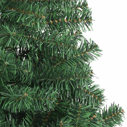 Close-up of the branches of a green artificial Christmas tree